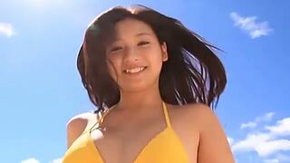 Cute Asian Teen 18+ Poses Seductively in Bikini on Sunny Beach