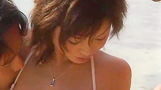 Japanese slut Natsumi Akimoto in wild threesomes and beach fucking.