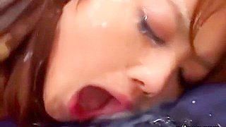 Stunning Japanese Beauty Gets Covered in Hot Cum During Bukkake Orgy!
