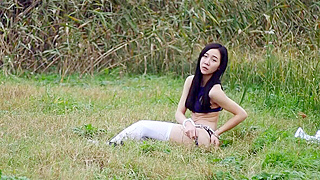 Alluring Chinese Beauty Seduces in Natural Surroundings