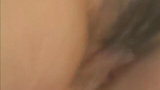 Pretty Japanese model fondles her wet pussy